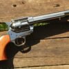 Colt Single Action Army replica revolver displayed in the USA, showcasing its classic Western-style design, polished metal finish, and traditional wooden grip. Colt Single Action Army Replica in USA
