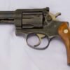 Ruger Security Six revolver displayed against a neutral background, featuring a stainless-steel finish, compact frame, and textured grips. Ruger Security Six For Sale USA
